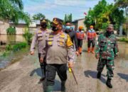 Kapolres  Batu Bara Berikan  Bantuan Sosial Warga Terdampak Banjir di Desa Kwala Sikasim