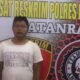 Pelaku perampokan, RH, warga Lingkungan VII Sebrang, Desa Perdagangan 1, Kecamatan Bandar, Simalungun, saat berada di Satreskrim Polres Batu Bara. (Foto: humas).