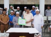 Peringatan HAUL Tuan Guru ke-99, Plt Bupati Langkat Serahkan 2 Ekor Sapi