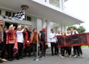Pj Gubsu Hassanudin Lepas Ulos 1.000 Meter ke Monas